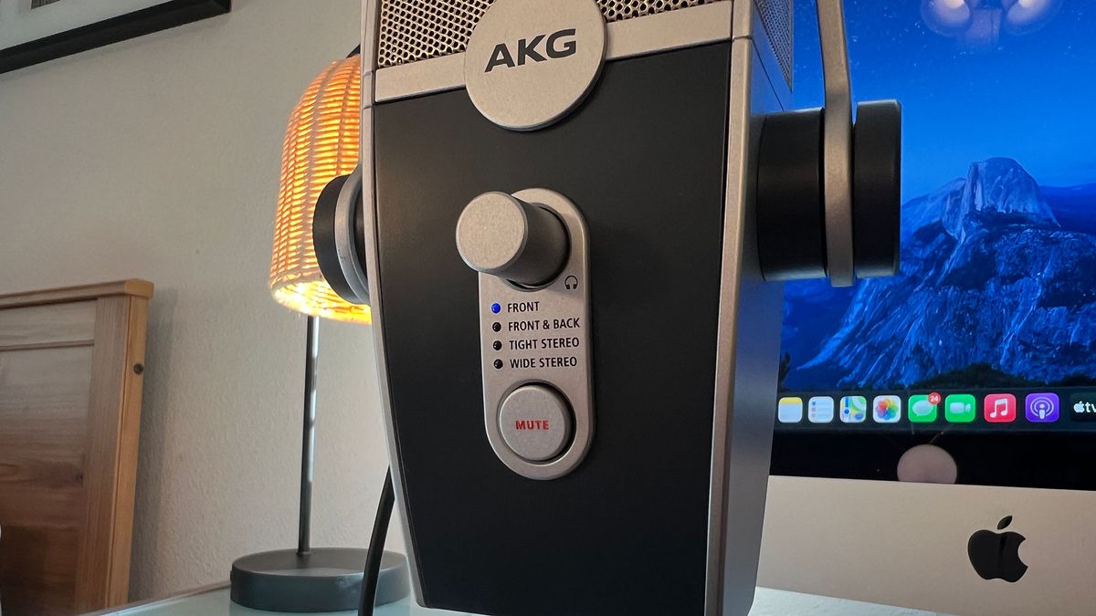 An AKG Lyra on a desk in front of an iMac