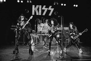 Kiss perform live on stage at Cobo Hall in Detroit during the cover shoot for Alive!