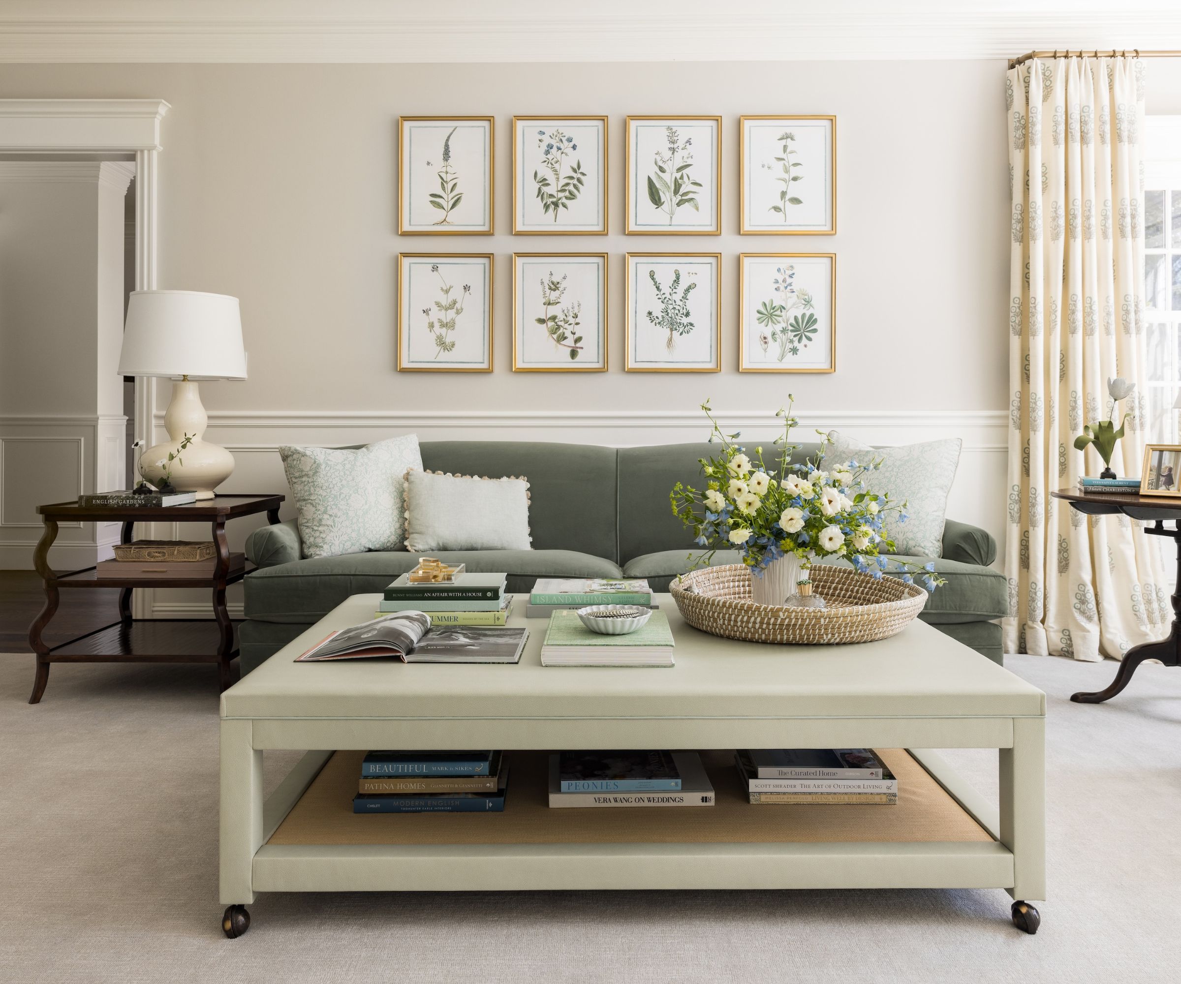 traditional living room with neutral walls and carpet, pistachio green coffee table, and moss green sofa