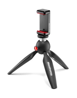 A black Manfrotto PIXI tripod with Universal Smartphone Clamp