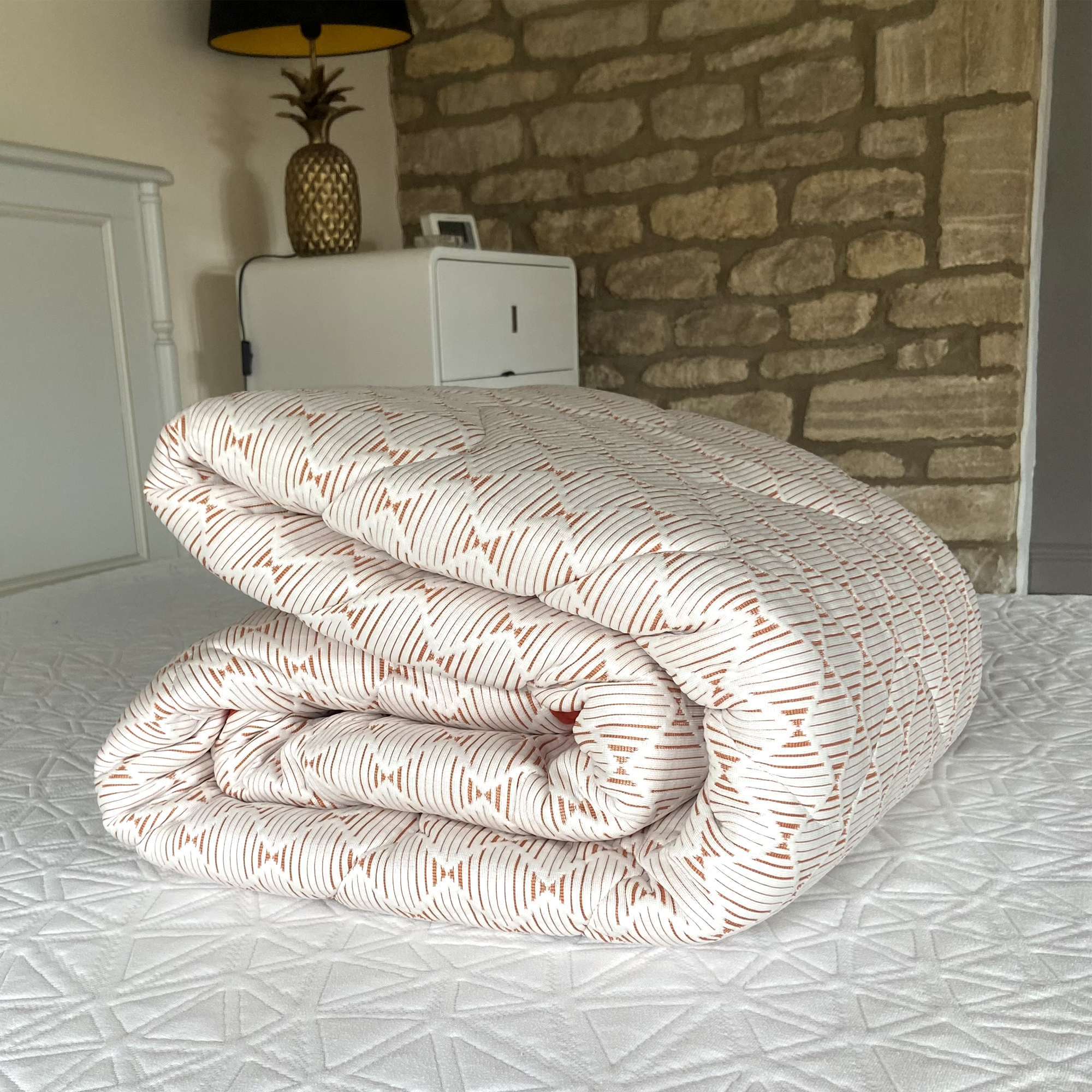 The Silentnight Restore Cooling Copper Topper being tested at home on a bed