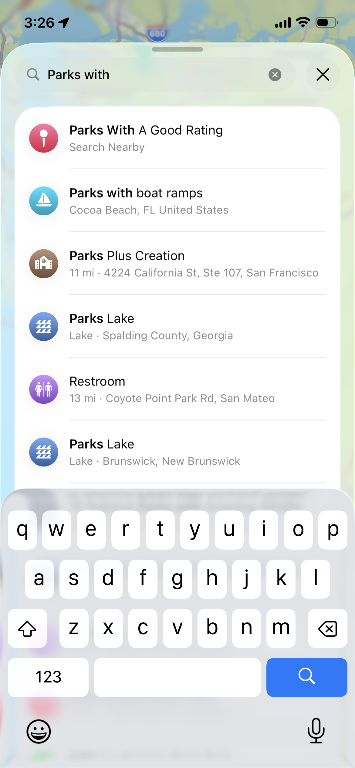 Screenshot of Apple Maps in iOS 26 public beta with natural language search