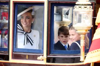 Catherine, Princess of Wales, Prince Louis of Wales and Princess Charlotte of Wales during Trooping the Colour at Buckingham Palace on June 15, 2024 in London, England.