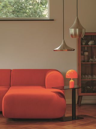 Tom Dixon new modular sofas feature plumped up shapes and orangey shades.