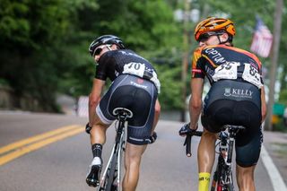 Matthew Busche (Trek) and Carter Jones (Optum) look to see what kind of gap they are getting on the field