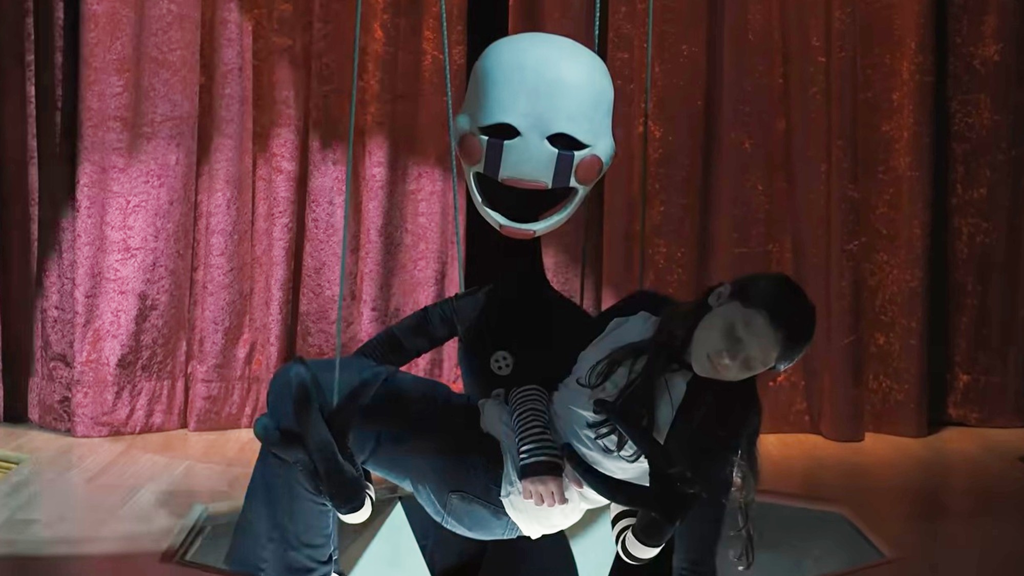The Marionette carrying a child in Five Nights at Freddy's 2