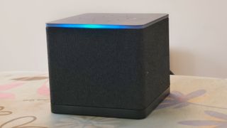 The Amazon Fire TV Cube glowing due to a voice command.