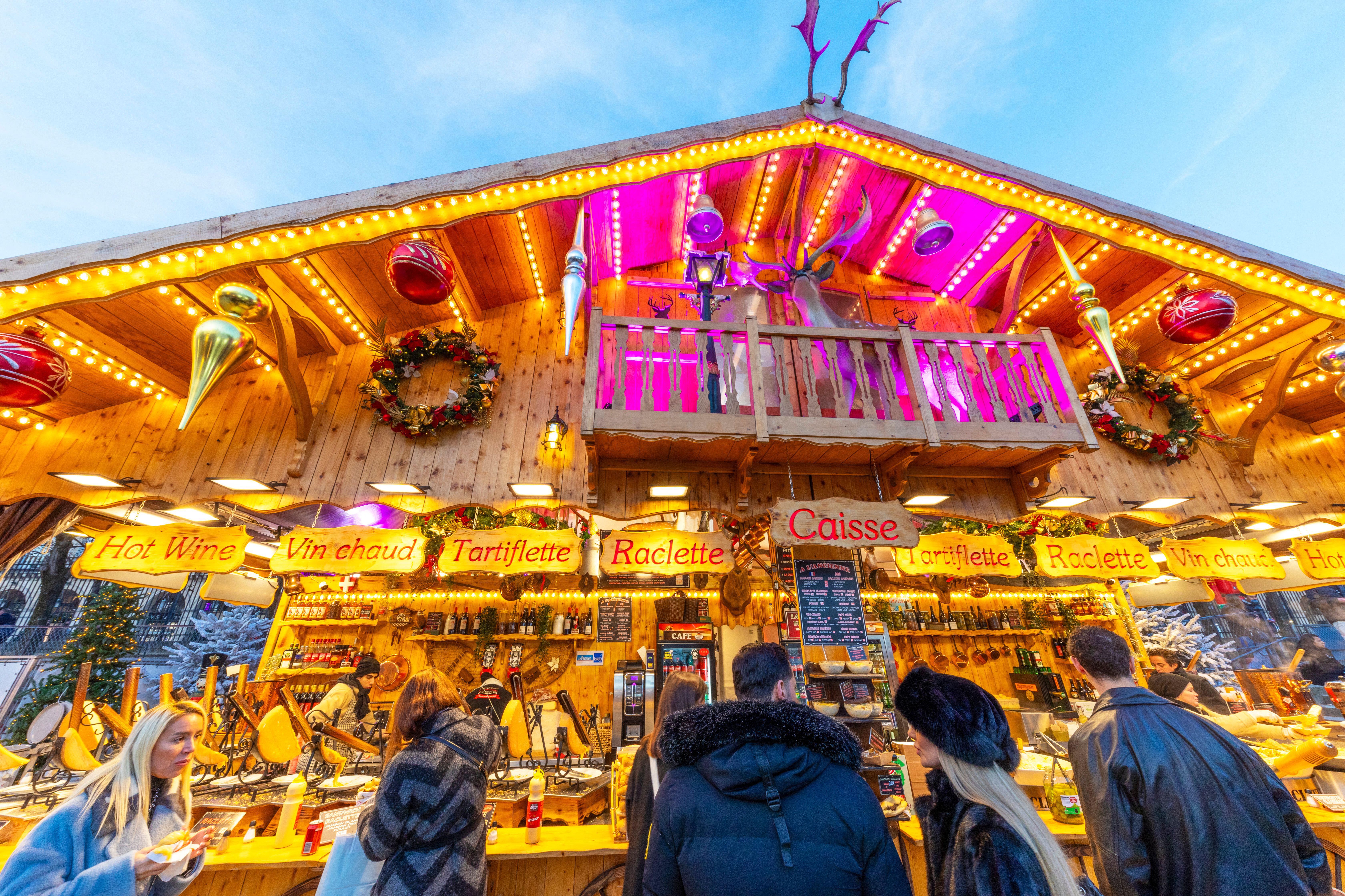 A market vendor sells tartiflette, raclette, vin chaud and other alpine classics