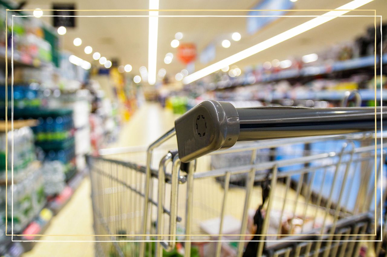 an extreme close up of a shopping trolley down a supermarket aisle during Easter 2023