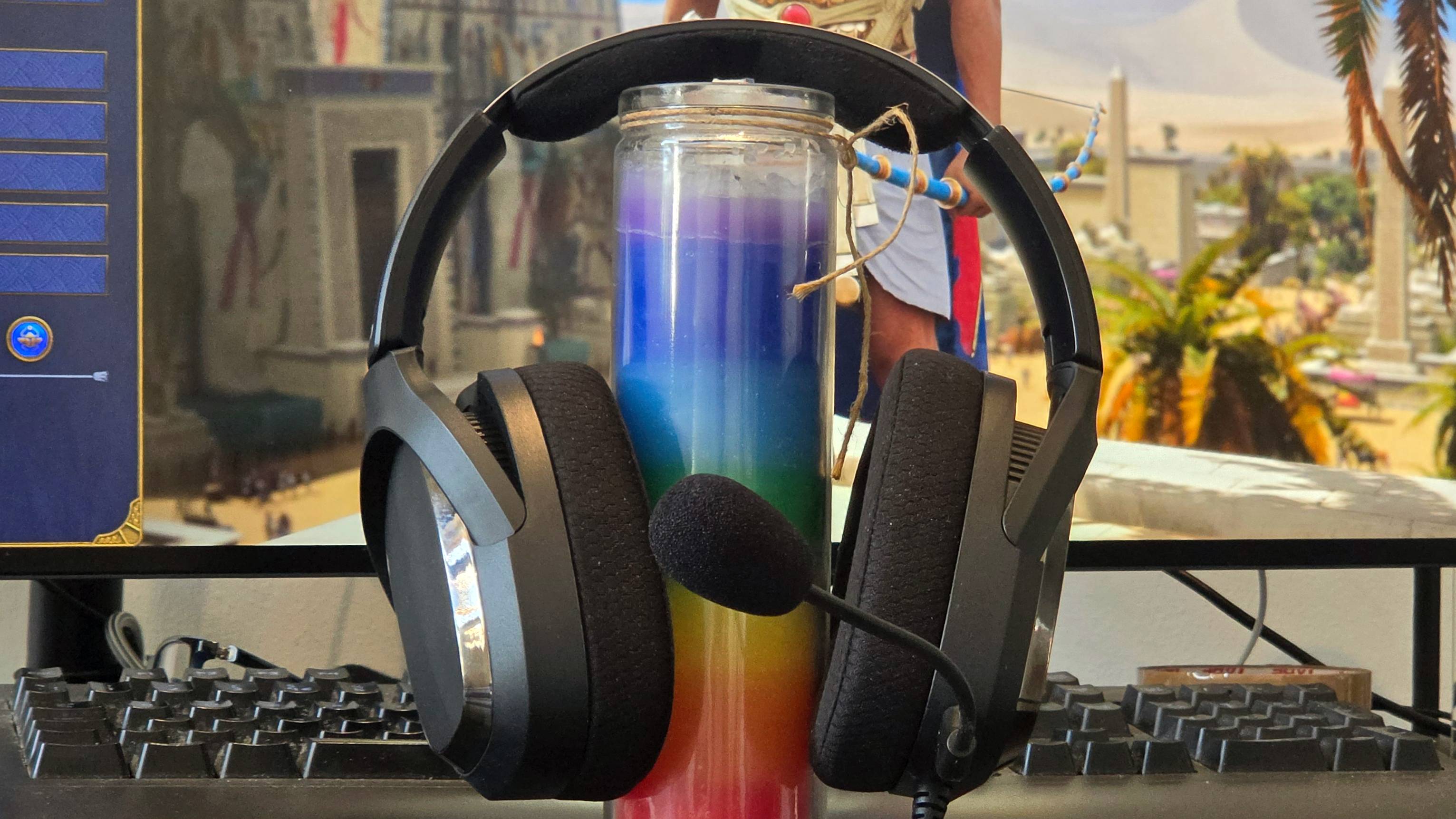 The FiiO FG3 perched on a candle, with Total War: Pharoah app in the background.
