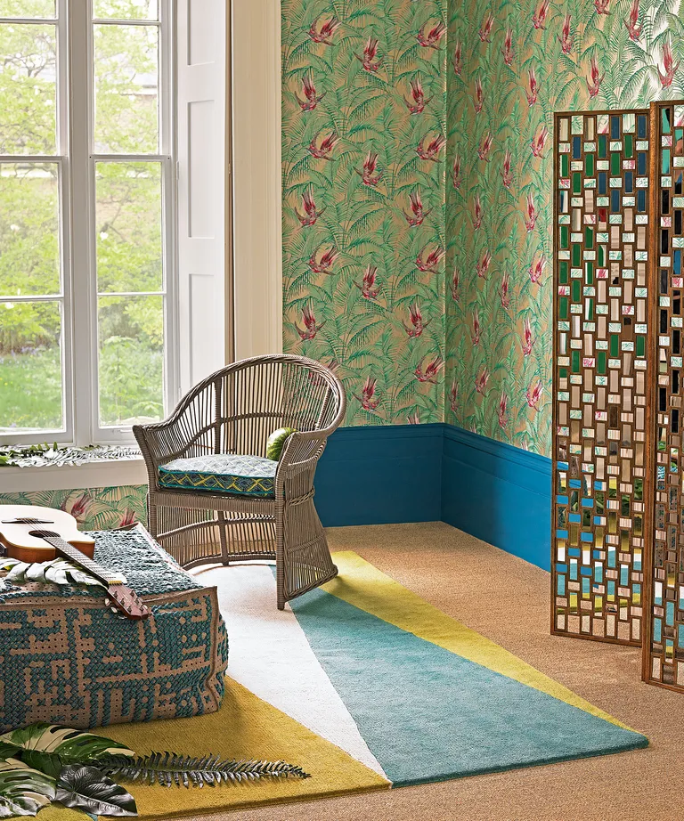 Bohemian bedroom ideas with patterned wall and rattan furniture