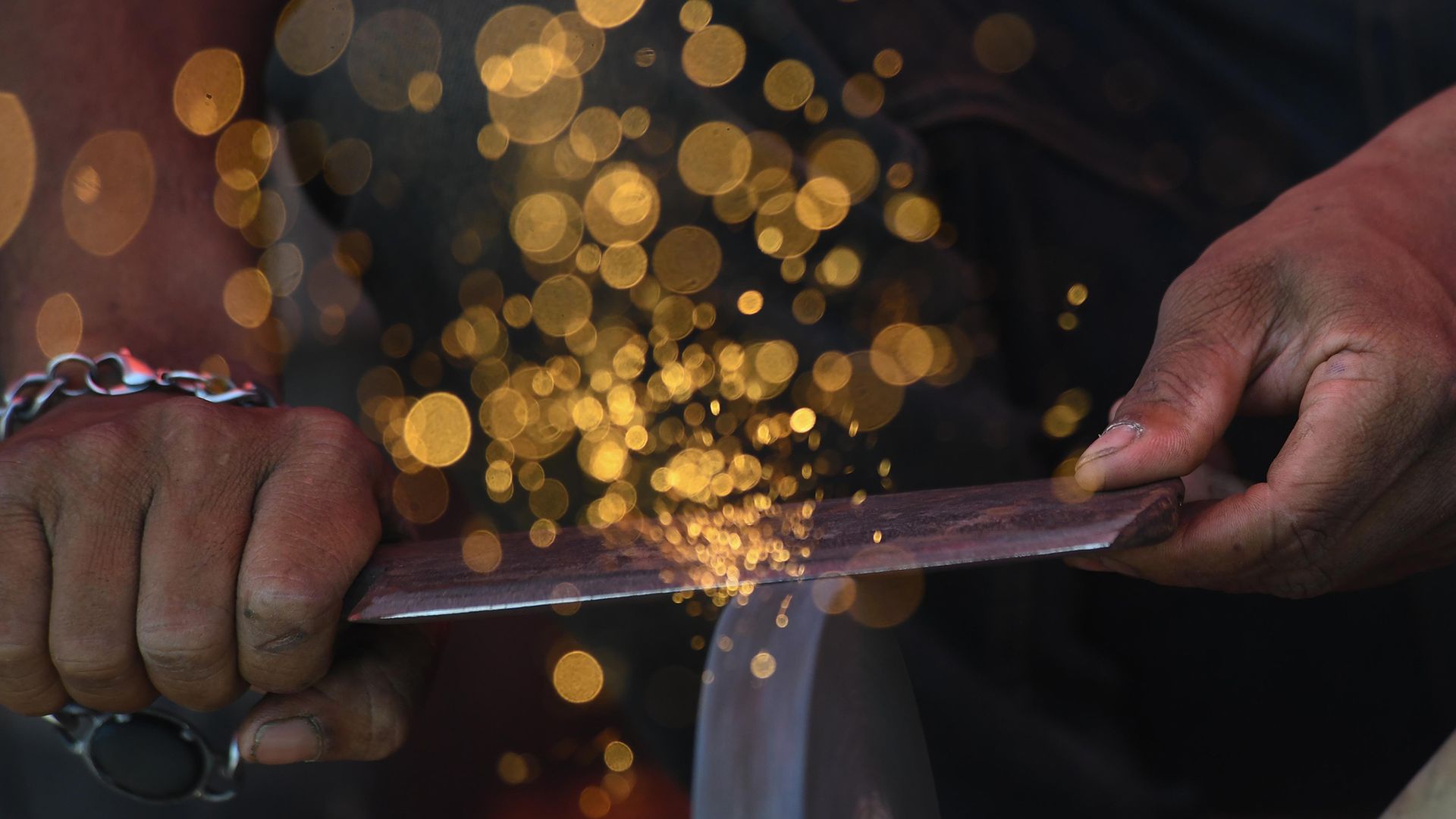
                                A blacksmith sharpens a knife ahead of the Eid al-Adha celebrations in Karachi, Pakistan
                            