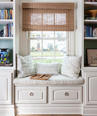 Window seat idea with window seat surrounded by bookcase