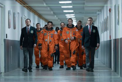 Astronauts from A Million Miles Away walking down a corridor