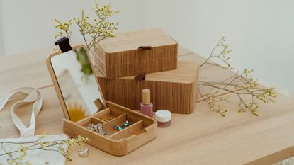 Modern organizers in wood with jewelry at home jewelry box and flowers