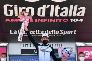 ALPE DI MERA VALSESIA ITALY MAY 28 Simon Yates of United Kingdom and Team BikeExchange stage winner celebrates at podium during the 104th Giro dItalia 2021 Stage 19 a 166km stage from Abbiategrasso to Alpe di Mera Valsesia 1531m Stage modified due to the tragic events on May the 23rd 2021 that involved the Mottarone Cableway Kask Utopia Giro Helmet designed by MotoGP artist Aldo Drudi to stage winners UCIworldtour girodiitalia Giro on May 28 2021 in Alpe di Mera Valsesia Italy Photo by Stuart FranklinGetty Images