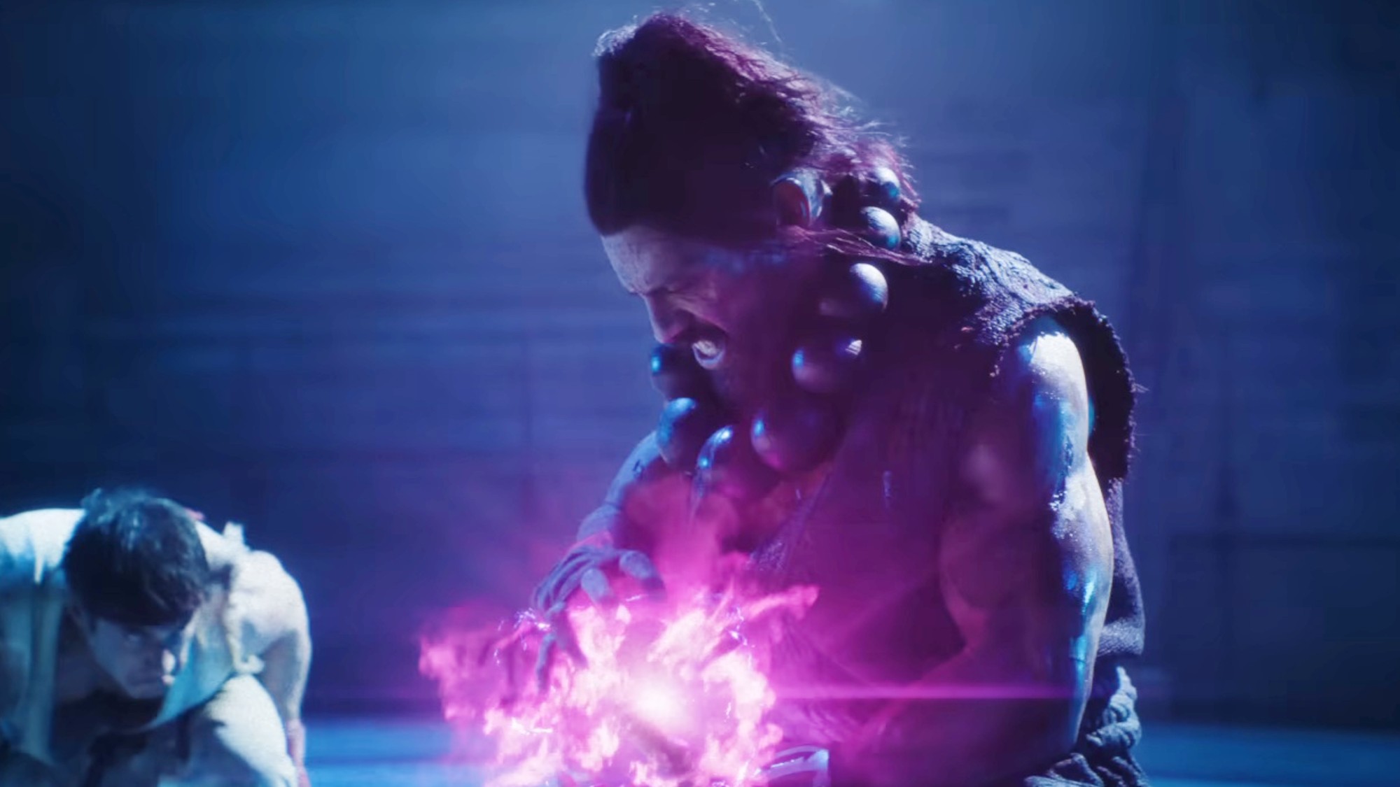 Roman Reigns about to throw a fireball in Street Fighter