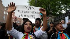 Protesters at a rally for Yves Sakila in Dublin following his death.