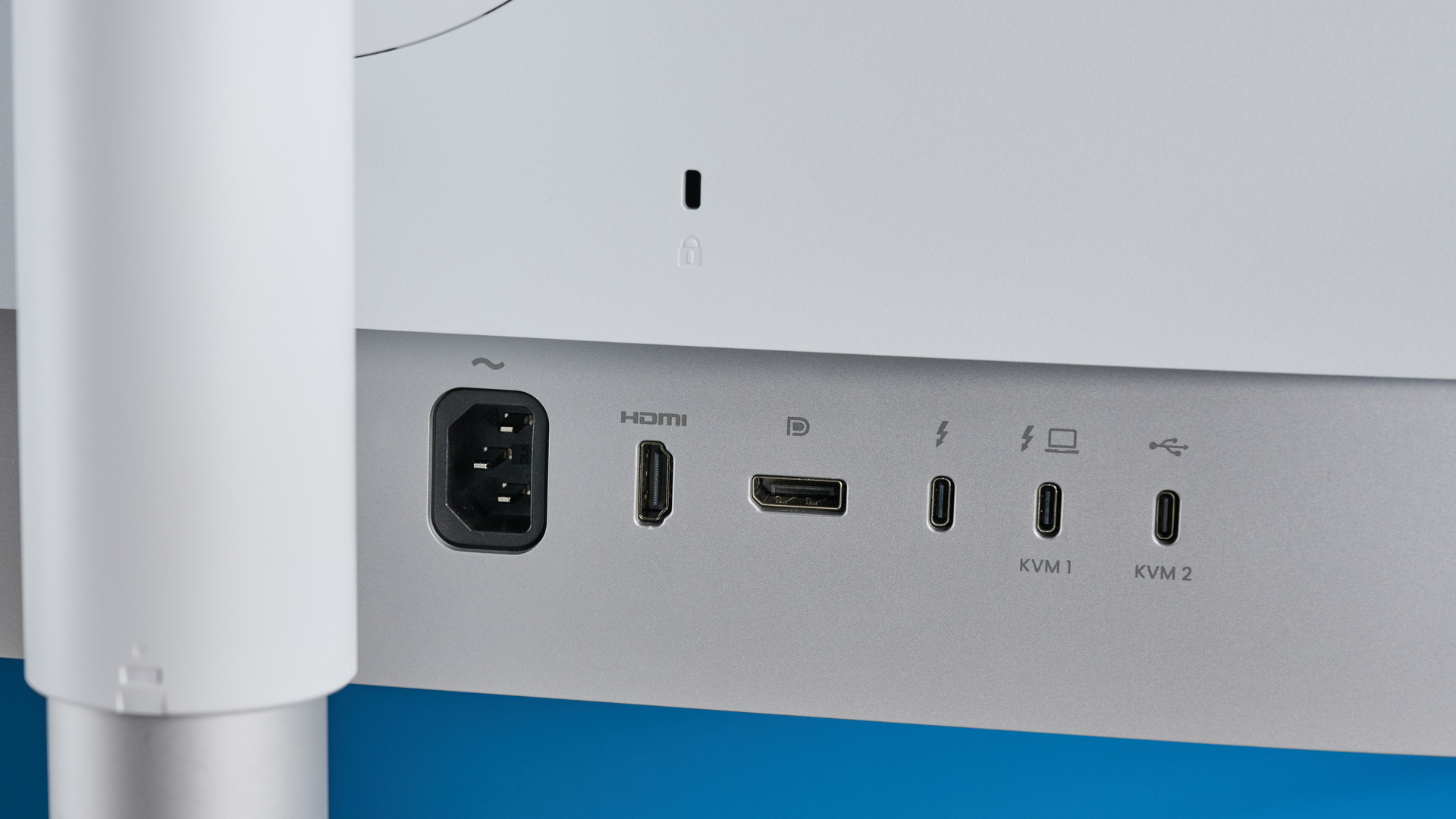 A photo of the BenQ PD3226G monitor in a blue-walled studio