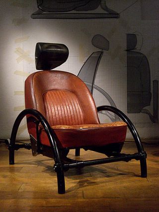 The Rover Chair, 1981. A brown leather chair with legs and arm rests made of curved black metal.