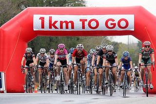 Women pass through the one kilometre sign at an Australian World Cup event