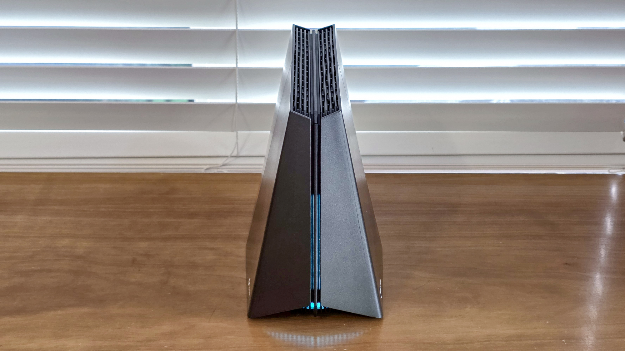 A TP-Link Archer GE650 router on a windowsill