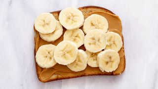 Bread with peanut butter and sliced bananas