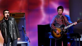 Liam and Noel Gallagher onstage with Oasis in Italy, 2008