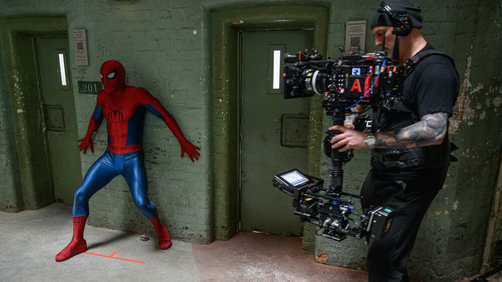 Set photos from Spider-Man: Brand New Day showing crew filming with an Alexa 265 and a custom Panavision lens