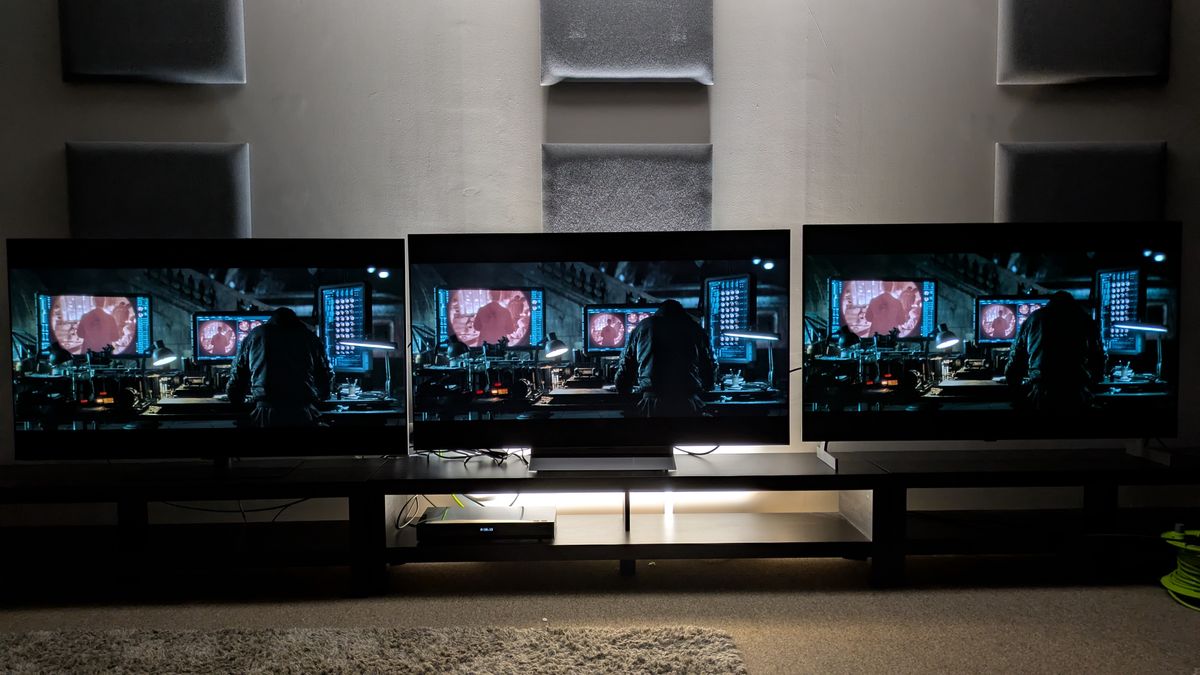 LG G6 (left) vs LG C6 (middle) vs LG B6E (right) showing Bruce at his desk in the Batcave from The batman. All three TVs show great contrast, but the G6's has the punchiest highlights