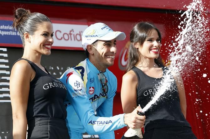 Fabio Aru (Astana) celebrates on the podium after winning stage 18