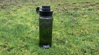 Yeti water bottle in the grass