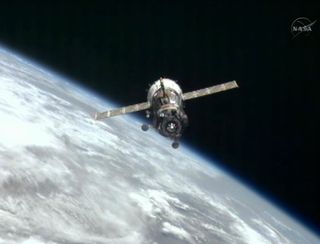 The Russian Soyuz TMA-03M backs away from the International Space Station after undocking on July 1, 2012.