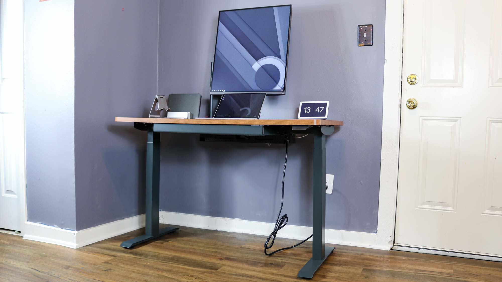 The Branch Duo Standing Desk outfitted with a monitor, laptop and smart display