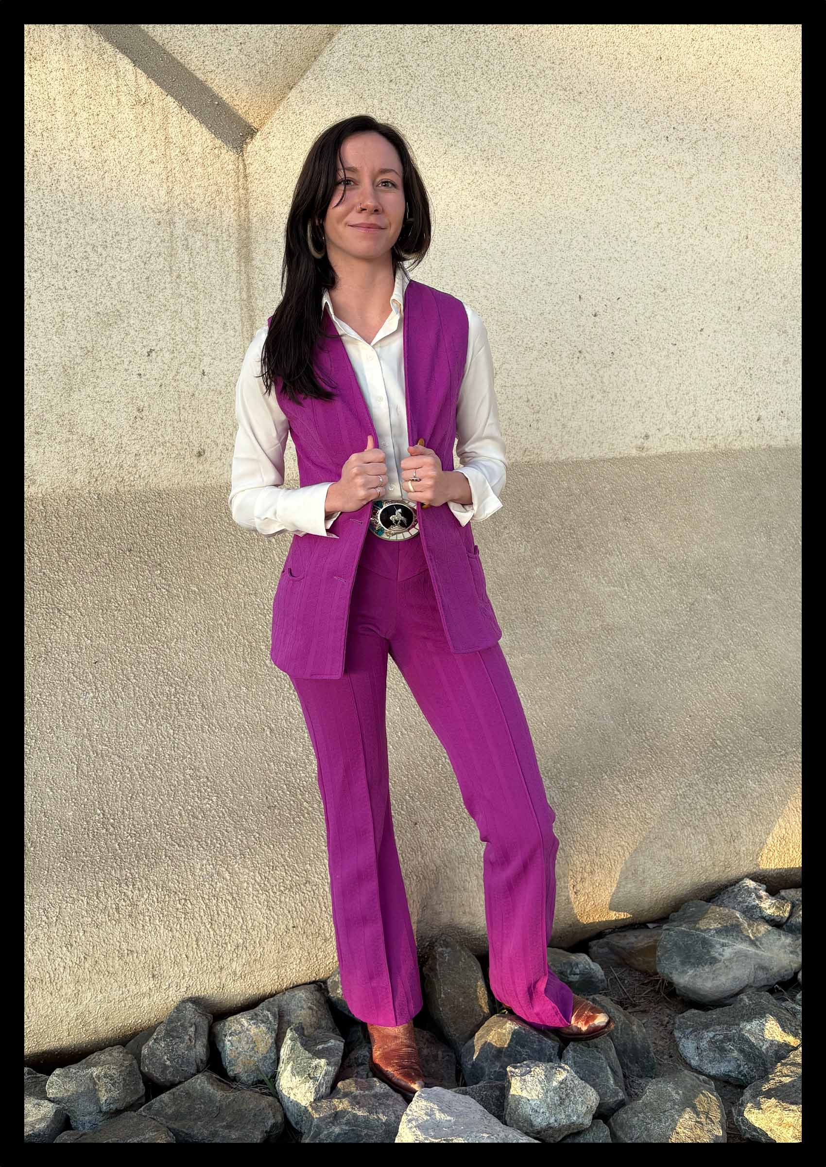 Sophia Schwartz wearing a purple suit and indigenous jewelry
