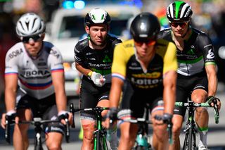 Mark Cavendish rides to the finish after crashing in the finale of stage 4 at the Tour de France