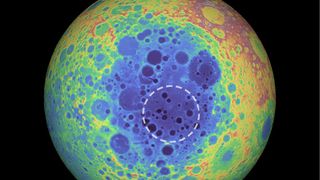 The South Pole-Aitken basin (represented by the shades of blue at the center) stretches 1,550 miles (2,500 kilometers) across and is one of the solar system’s largest craters. The dashed circle indicates the spot where researchers found a weird material beneath the basin that contains metal.
