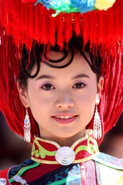 One of the podium girls in traditional dress.