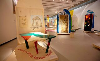 Gallery displaying a colourful table, sketches and drawings