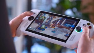 Hands holding white ROG Xbox Ally with Towerborne gameplay on screen.