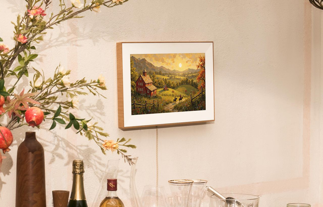 Pexar Starlight digital photo frame mounted to a wall in daytime