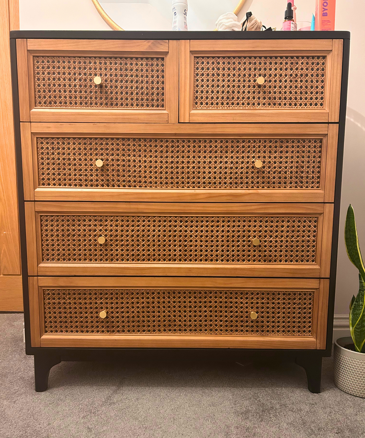A rattan chest of drawers looking neat and tidy