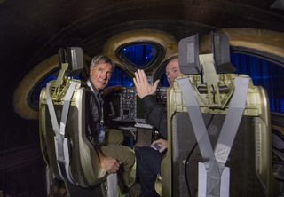 Actor and pilot Harrison Ford (left) and Virgin Galactic chief pilot Dave Mackay inside the new Virgin Spaceship Unity during its unveiling in Mojave, California, on Feb. 19, 2016.
