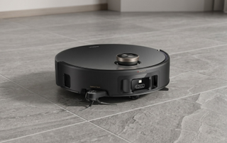 MOVA robot vacuum cleaner on grey tiled floor