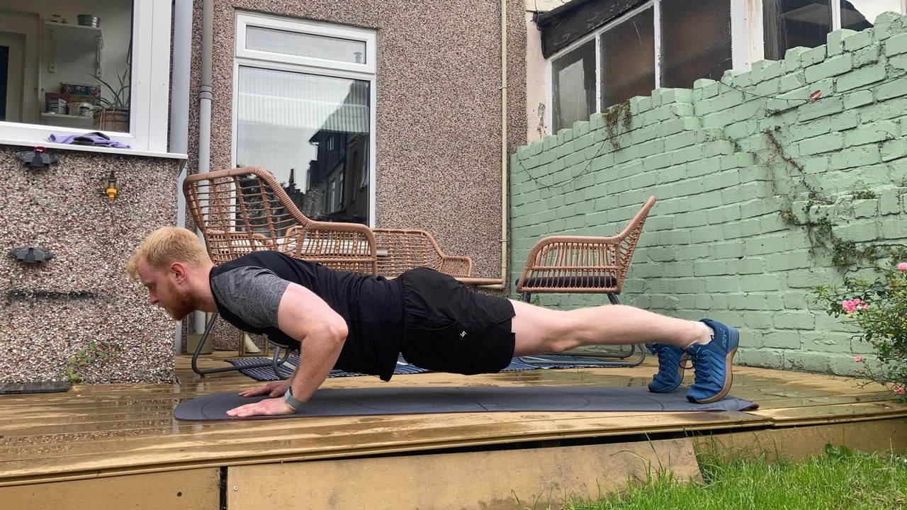 Fit&amp;Well fitness writer Harry Bullmore performing a push-up