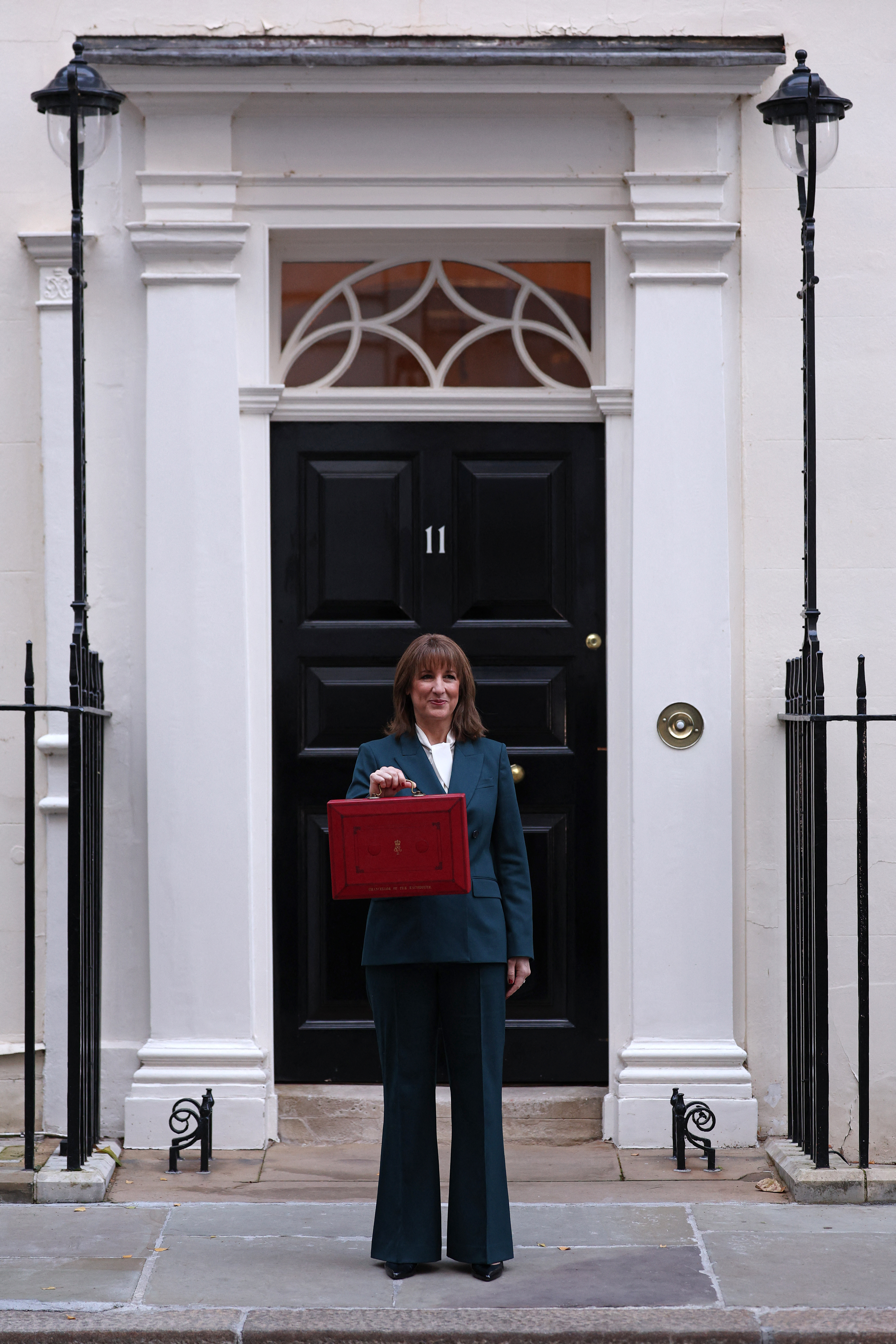 Chancellor Rachel Reeves stands outside Number 11 Downing Street with Budget red box on 2025 Autumn Budget day.
