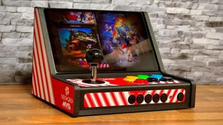 A Lenovo Legion Go slotted into a mini arcade cabinet from Etsy