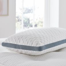 Silentnight Geltex Pillow on a bed in front of a window