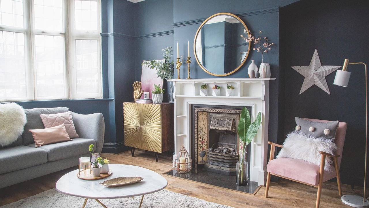 stone fireplace in navy sitting room