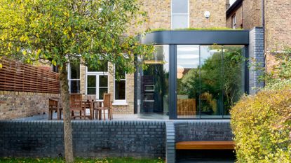 curved glass extension found at the rear of a victorian terraced house photographed by william eckersley